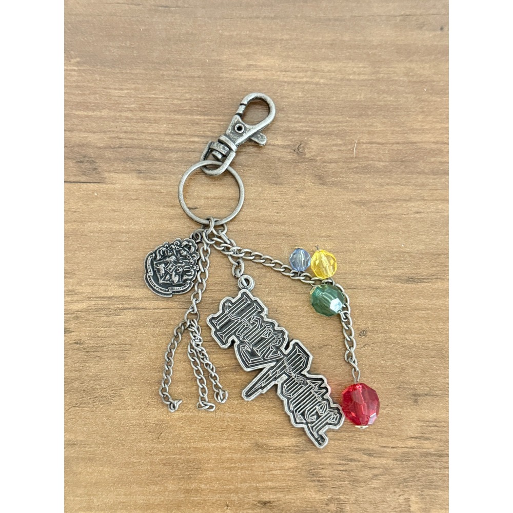 Harry Potter Logo Hogwarts Crest Keychain Silver Tone Charms House Colors 2009